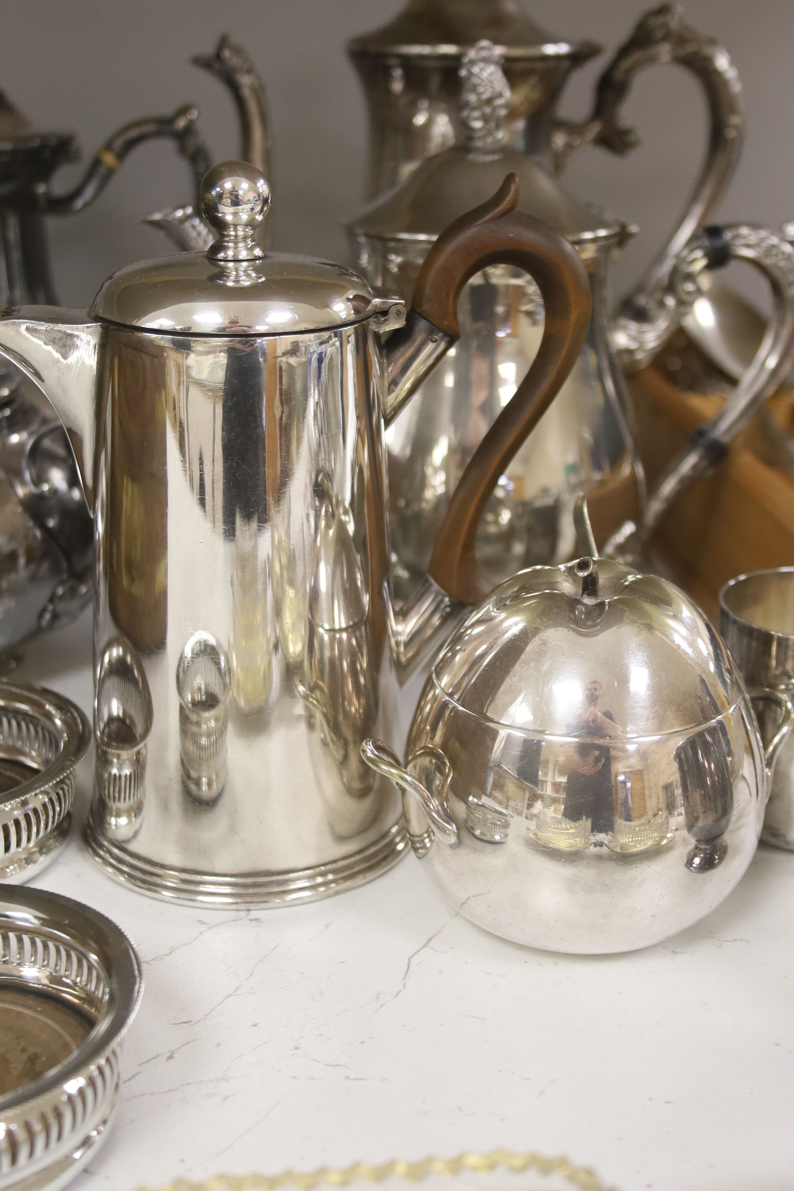 A group of assorted plated wares including a set of four gilt salts and a butter dish